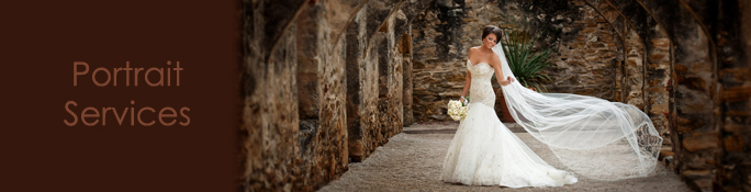 Portrait of a bride posed with a bouquet and veil.